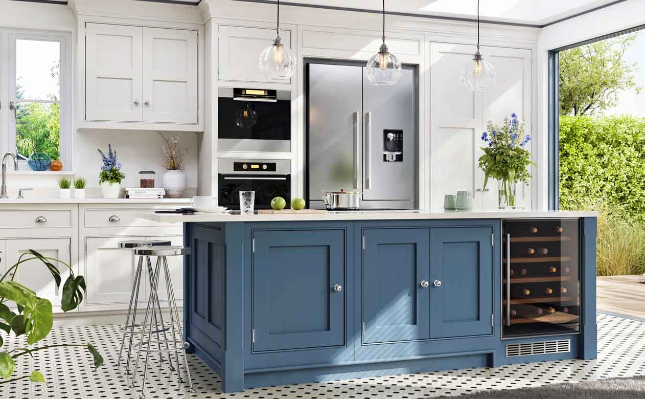 bright kitchen with white cabinets, blue cabinets, and penny tile flooring