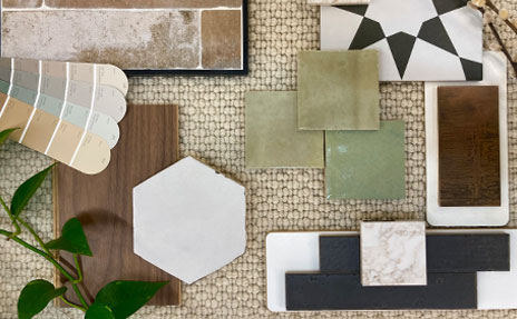 biophilic interior design flatlay with woodlook and calming green tones